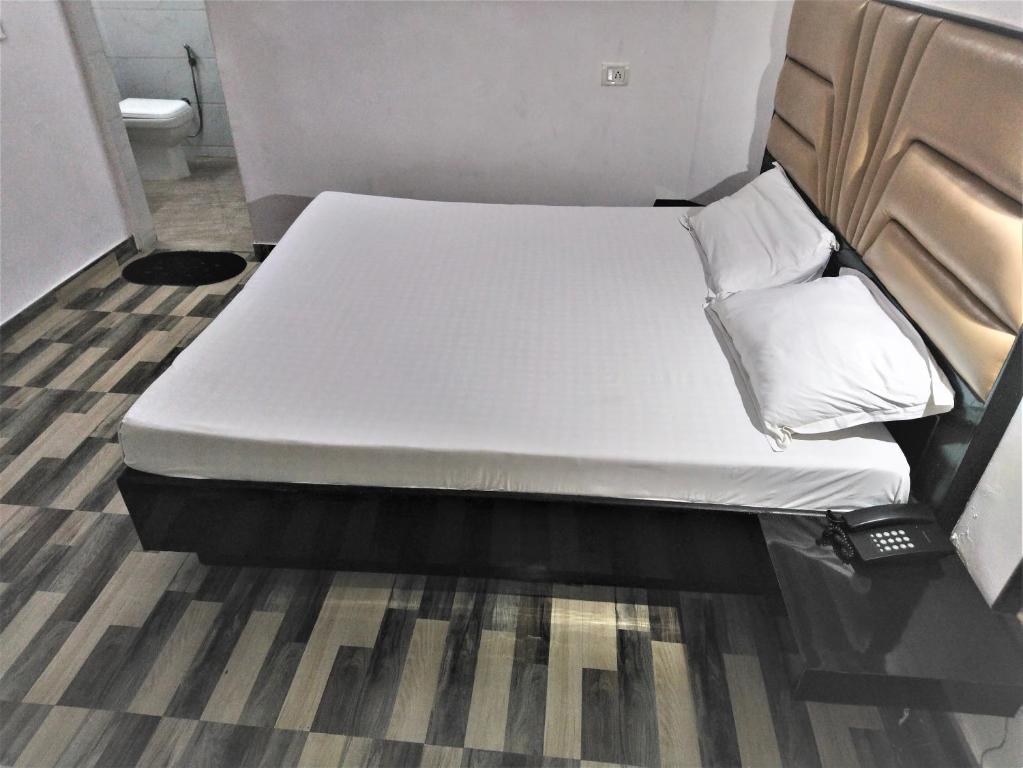 Postel nebo postele na pokoji v ubytování Hotel Kwality