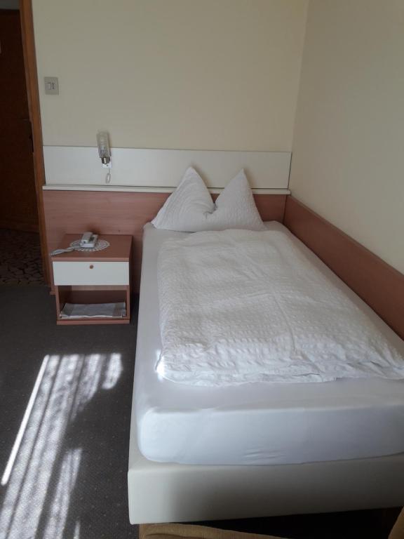 Postel nebo postele na pokoji v ubytování Hotel Lux