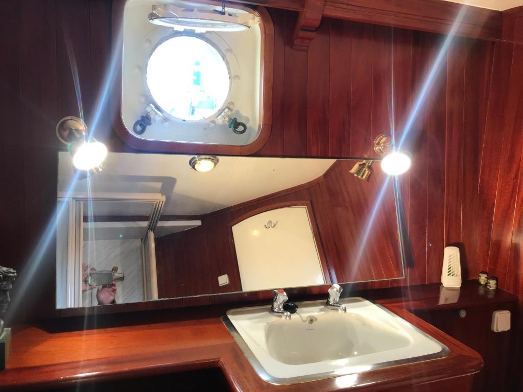 a bathroom with a sink and a mirror at Don Maximo in Vigo