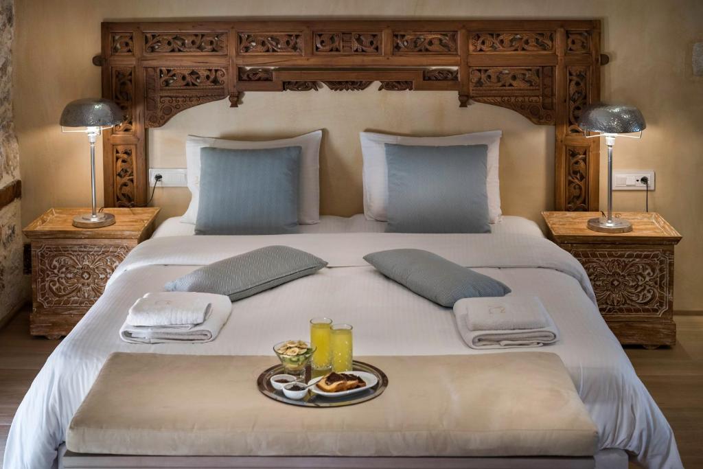 Postel nebo postele na pokoji v ubytování Residenza Vranas Boutique Hotel