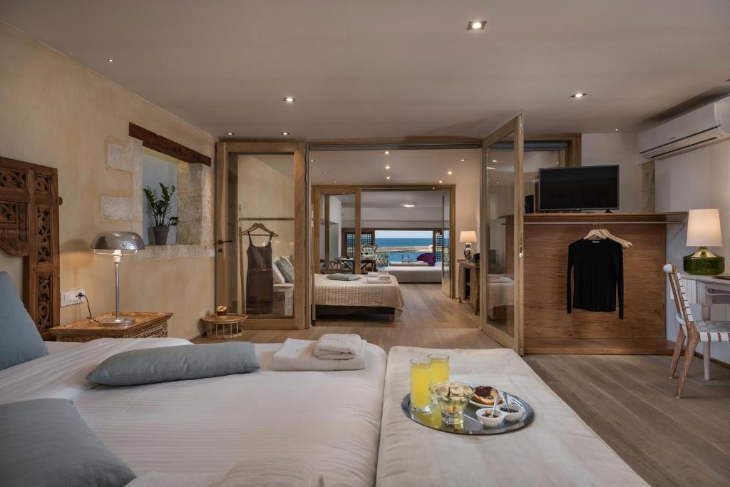 Postel nebo postele na pokoji v ubytování Residenza Vranas Boutique Hotel