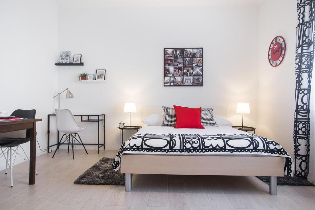 a bedroom with a bed and a table and a desk at Angela Luxury Studio Apartment in Zagreb