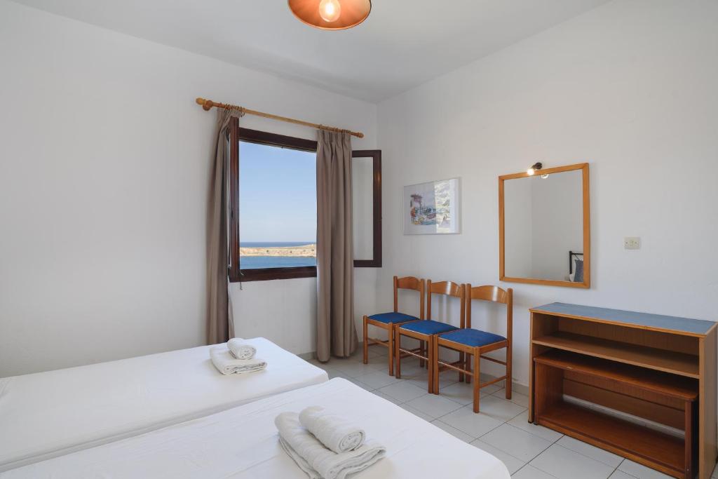 Postel nebo postele na pokoji v ubytování Aphrodite White Studios Lindos