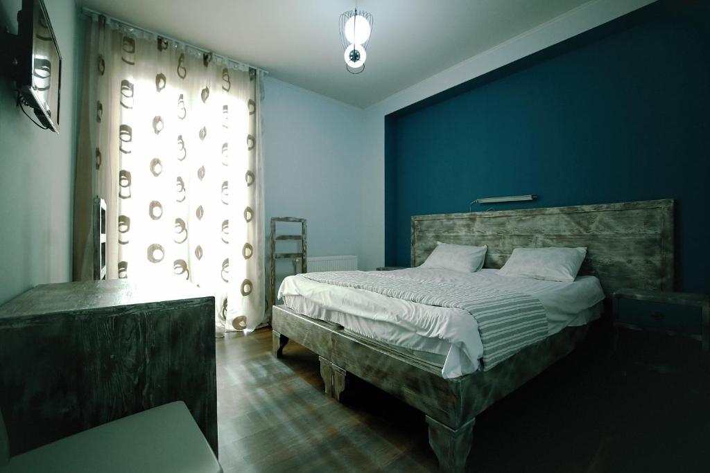 Postel nebo postele na pokoji v ubytování Hotel Kutaisi Globus
