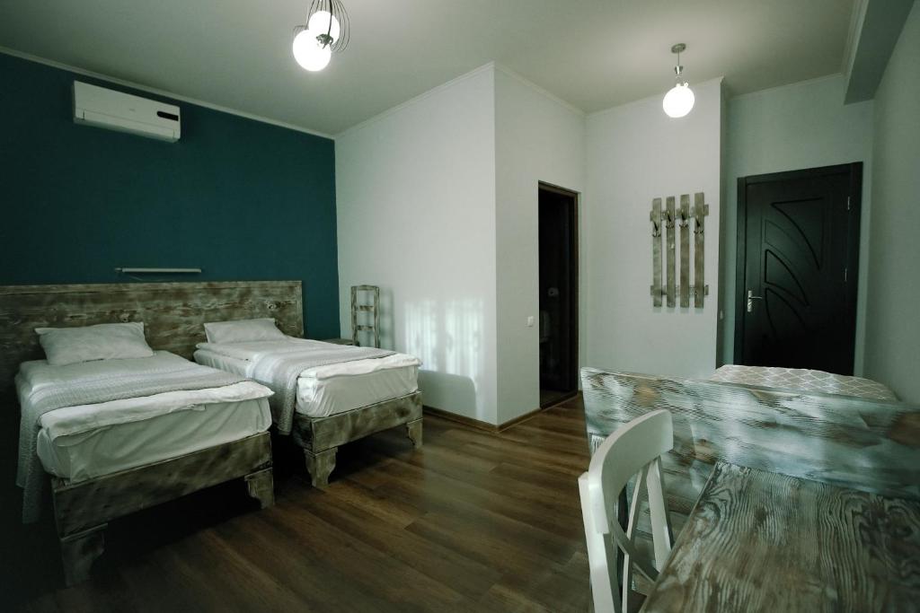 Postel nebo postele na pokoji v ubytování Hotel Kutaisi Globus