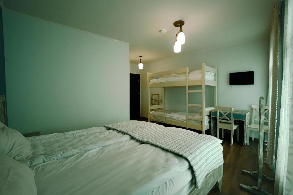 Postel nebo postele na pokoji v ubytování Hotel Kutaisi Globus