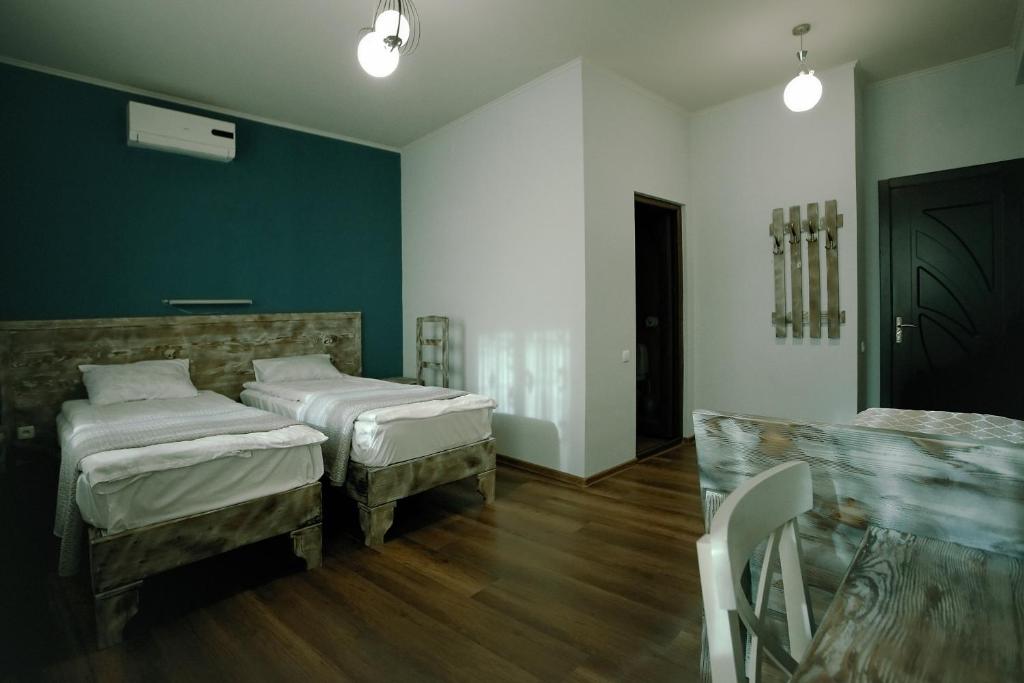Postel nebo postele na pokoji v ubytování Hotel Kutaisi Globus