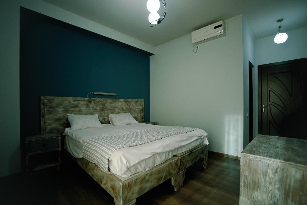 Postel nebo postele na pokoji v ubytování Hotel Kutaisi Globus