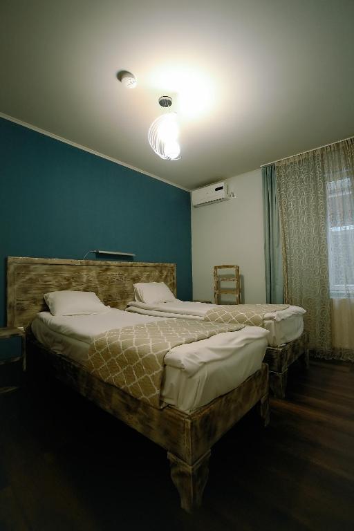 Postel nebo postele na pokoji v ubytování Hotel Kutaisi Globus