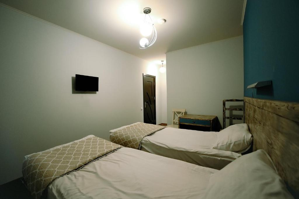Postel nebo postele na pokoji v ubytování Hotel Kutaisi Globus