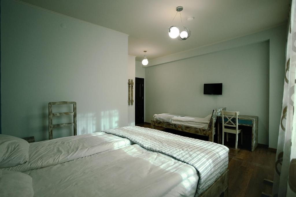 Postel nebo postele na pokoji v ubytování Hotel Kutaisi Globus