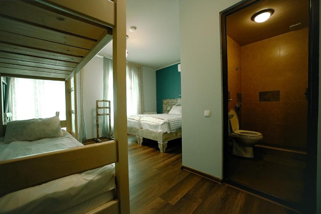 Postel nebo postele na pokoji v ubytování Hotel Kutaisi Globus