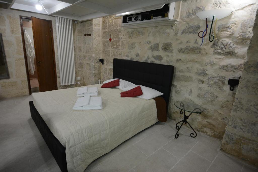 Postel nebo postele na pokoji v ubytování B&B DOMUS GAIA