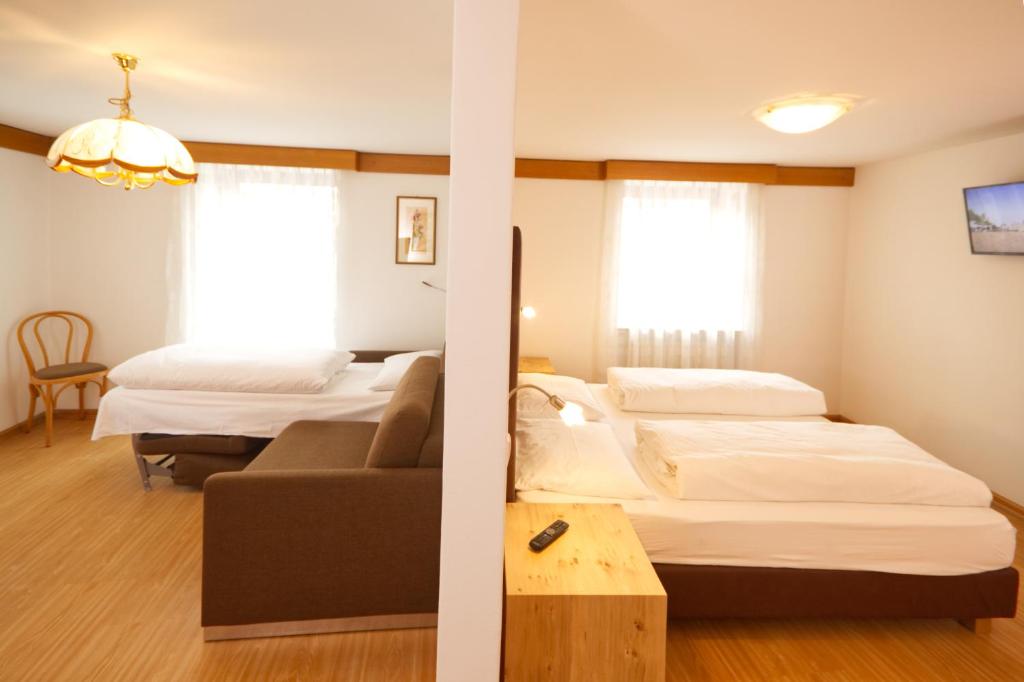 Postel nebo postele na pokoji v ubytování Pension & Residence Astoria