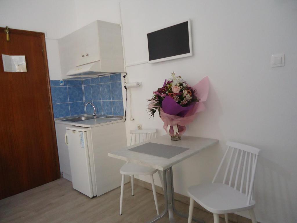 A kitchen or kitchenette at Kallithea Studios