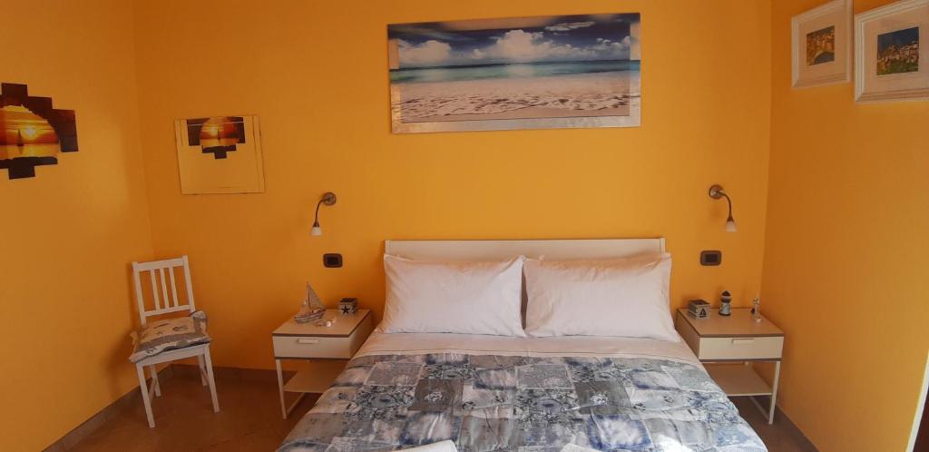 Postel nebo postele na pokoji v ubytování Casa vacanze Osvaldo