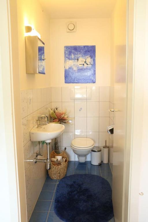 a bathroom with a sink and a toilet at Dimai House No 31 Dornbirn Messe in Dornbirn