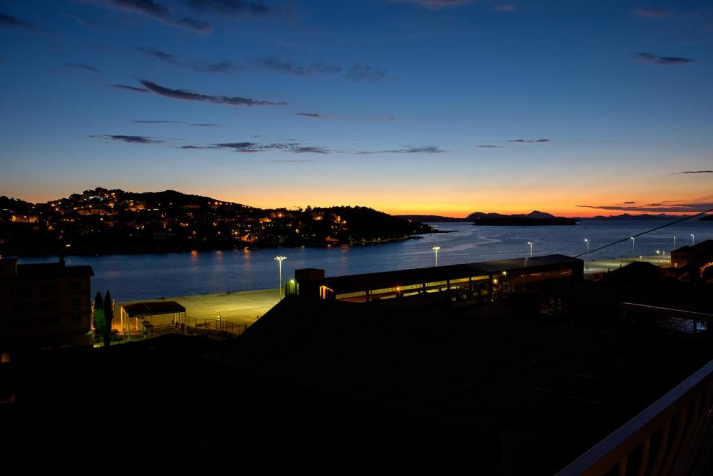 a view of a body of water at sunset at Nostromo Guesthouse with the Sea View in Dubrovnik
