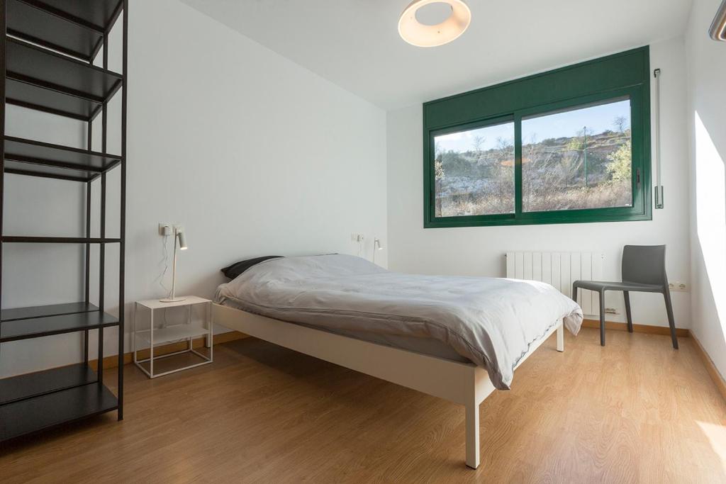 Postel nebo postele na pokoji v ubytování Casa Cornudella