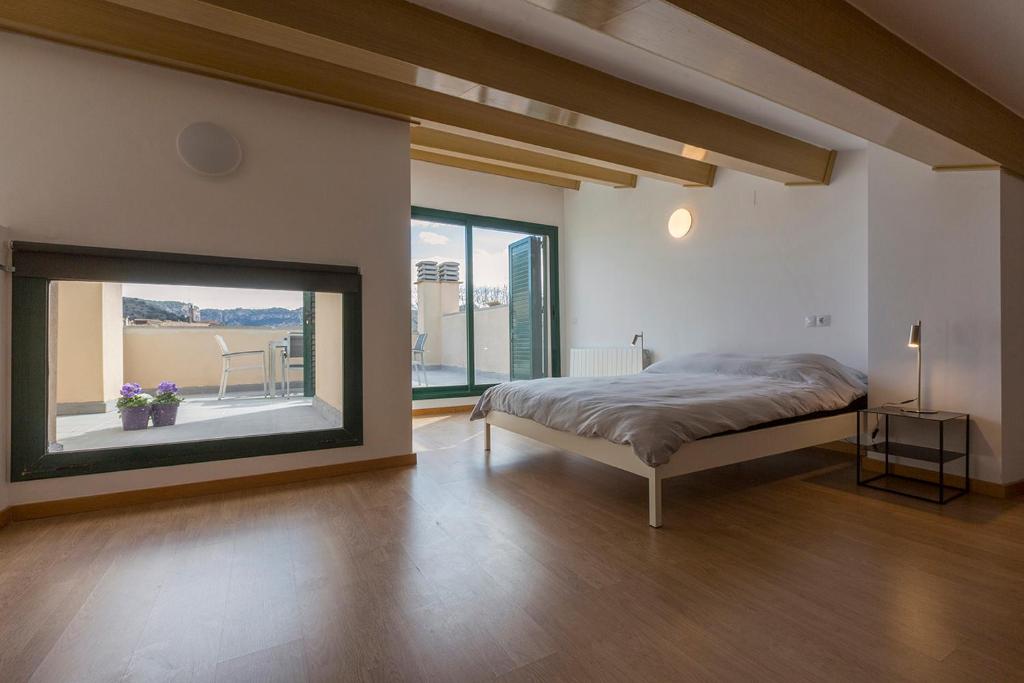 Postel nebo postele na pokoji v ubytování Casa Cornudella