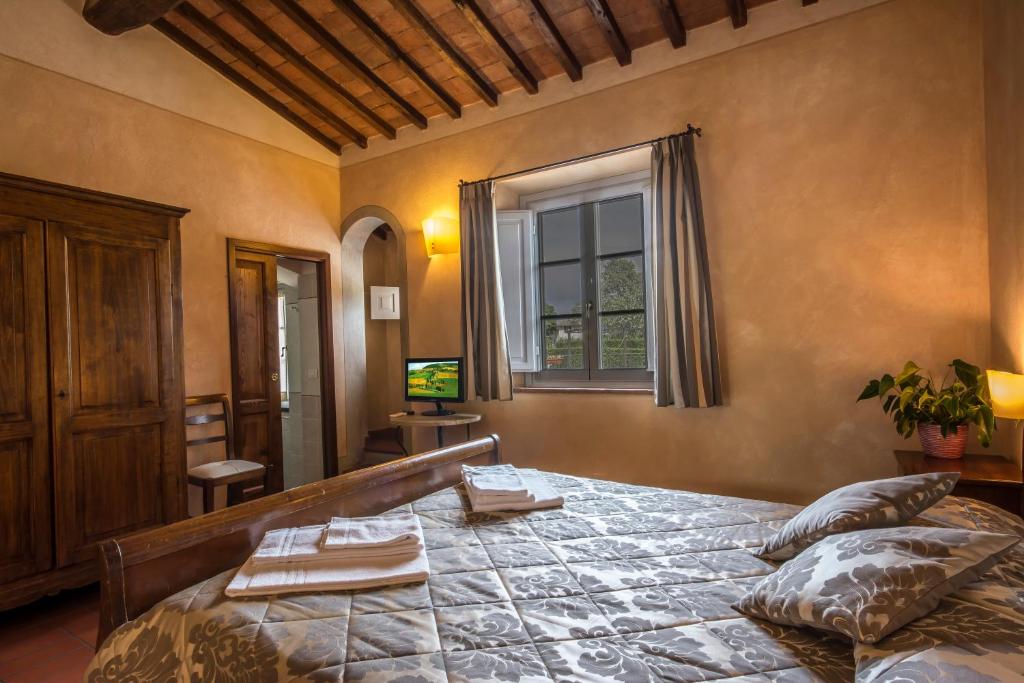 Łóżko lub łóżka w pokoju w obiekcie Antica Pieve B&B