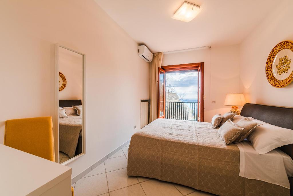 Postel nebo postele na pokoji v ubytování Villa Sant'Alfonso