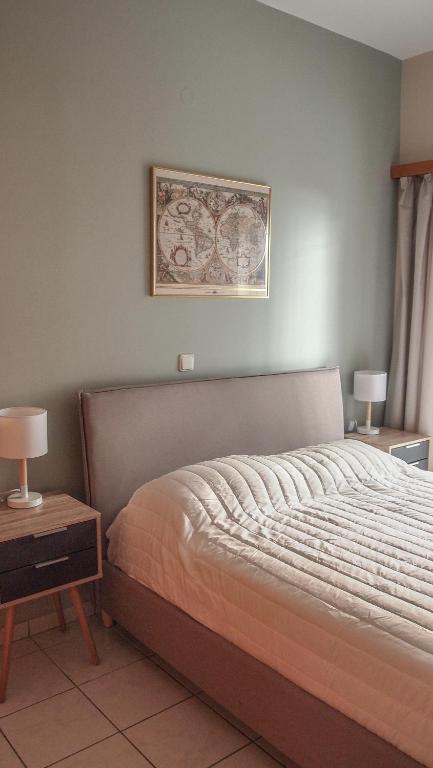 A bed or beds in a room at Sofia City Beach 3 Apts Nea Chora Chania steps from the beach