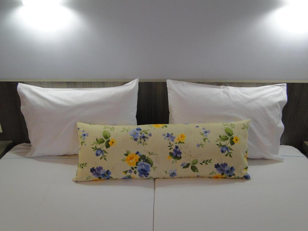 Postel nebo postele na pokoji v ubytování Hotel Olympos