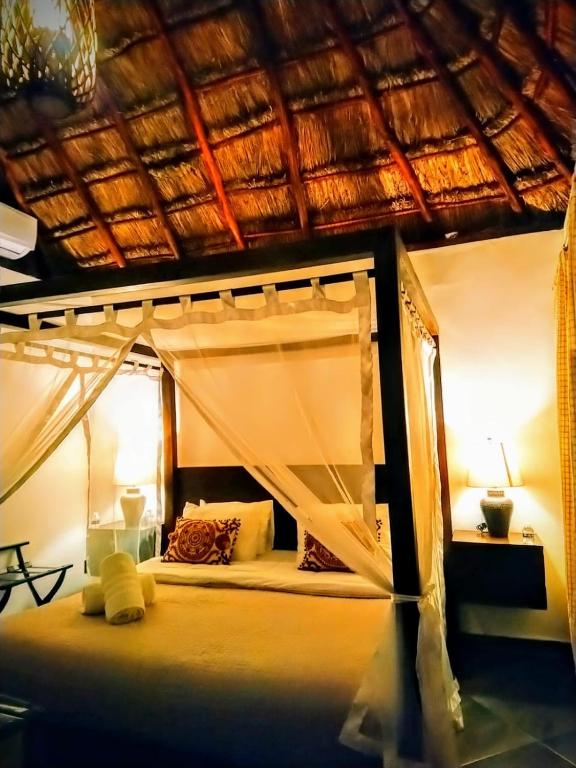 Postel nebo postele na pokoji v ubytování Hotel Sun Ha Bacalar