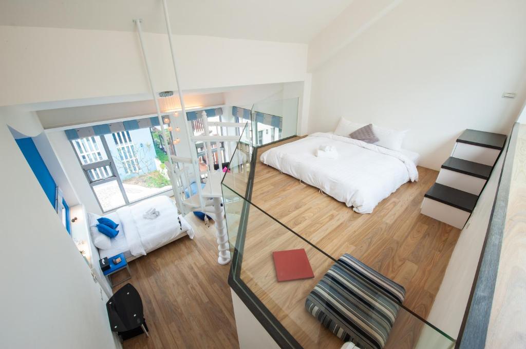 Postel nebo postele na pokoji v ubytování Hai Pu B&B