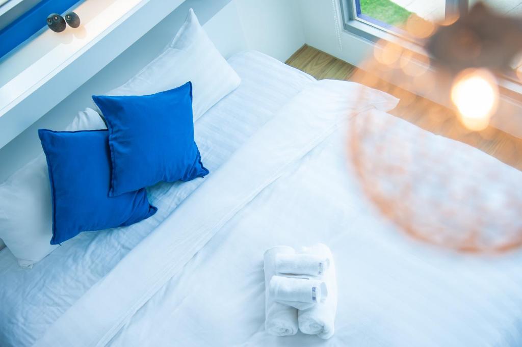 Postel nebo postele na pokoji v ubytování Hai Pu B&B