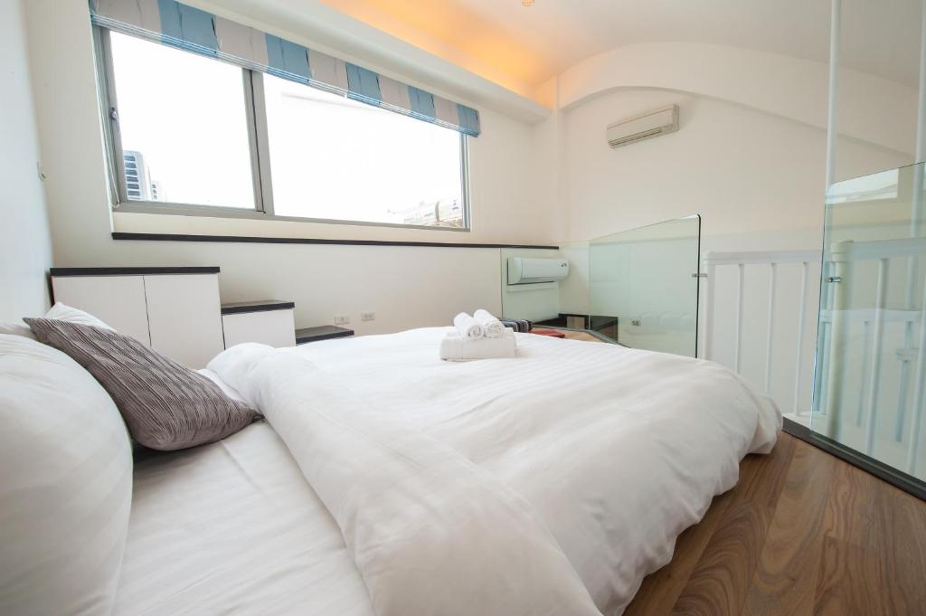 Postel nebo postele na pokoji v ubytování Hai Pu B&B