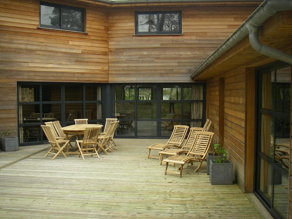 a wooden deck with a table and chairs on it at VILLA KB&#39;HOME in Le Touquet-Paris-Plage