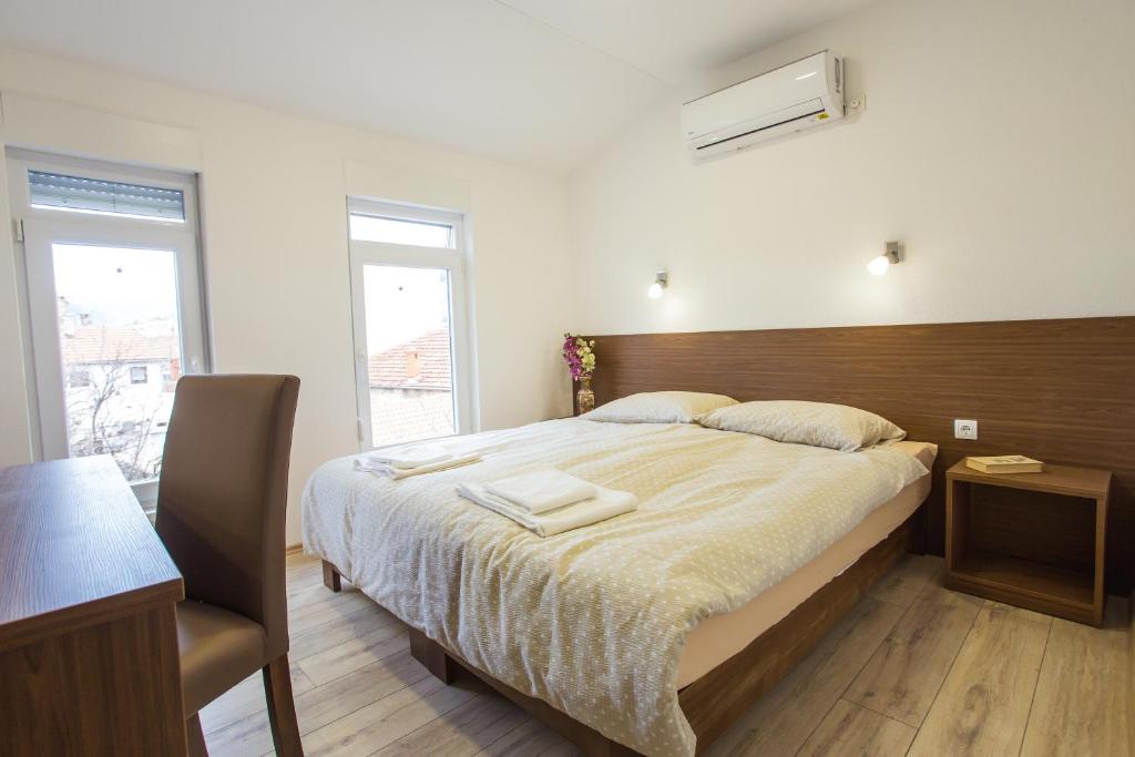 Postel nebo postele na pokoji v ubytování Apart AS