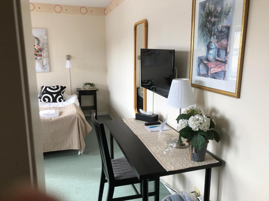 Postel nebo postele na pokoji v ubytování Kils Hotell & Restaurang