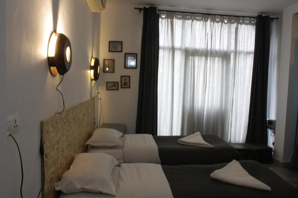 Postel nebo postele na pokoji v ubytování Bed & Chai Guesthouse