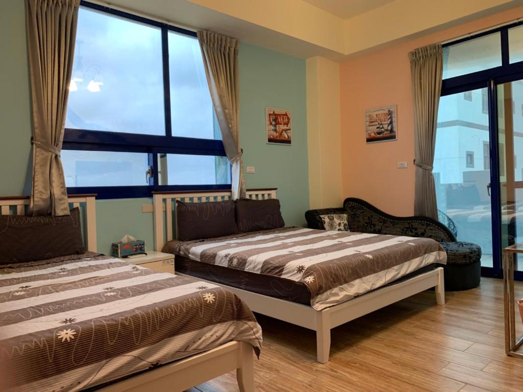 Postel nebo postele na pokoji v ubytování Qing Feng Diving B&B