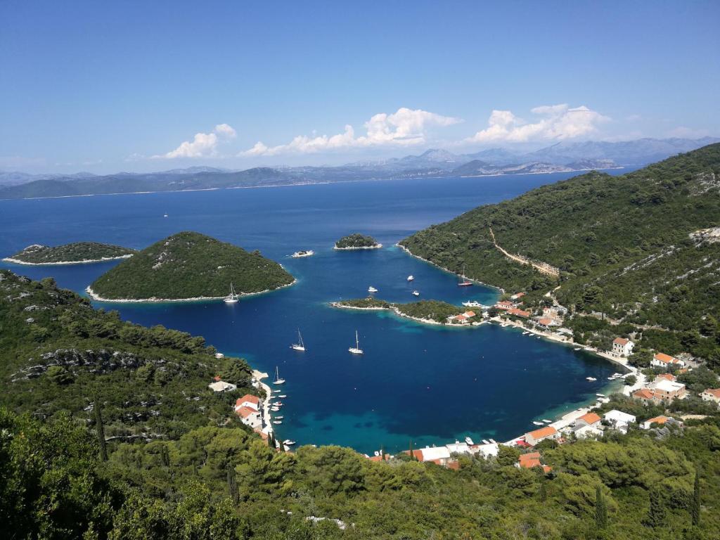 an aerial view of a bay with boats in the water at Sea Song in Maranovići