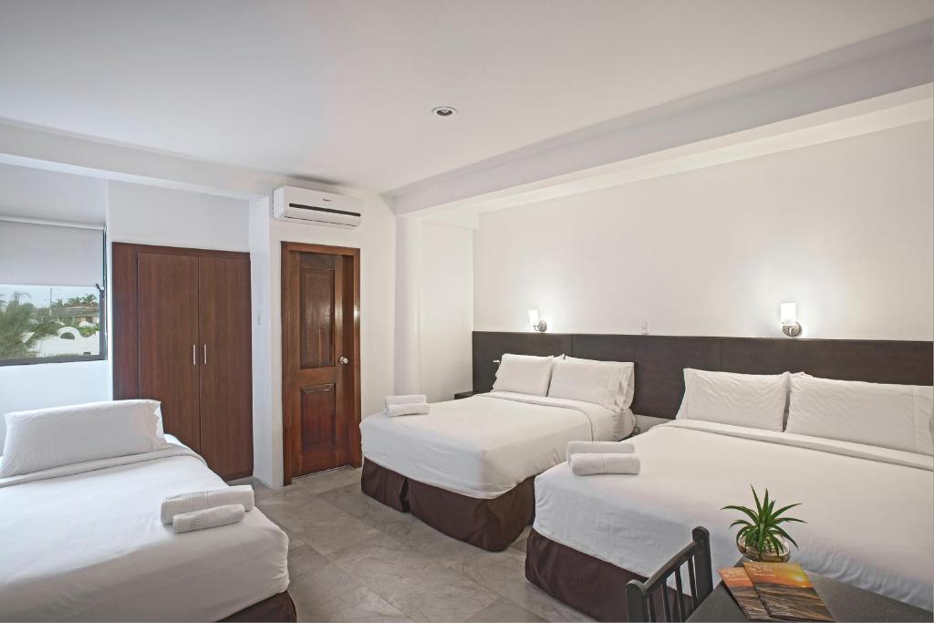 Postel nebo postele na pokoji v ubytování Hotel La Ría Playas