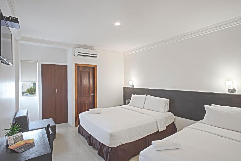 Postel nebo postele na pokoji v ubytování Hotel La Ría Playas