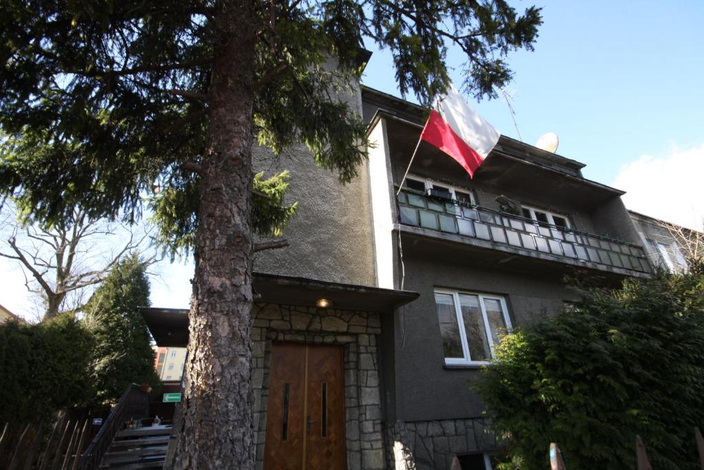 a house with a tree in front of it at Żwirki in Częstochowa