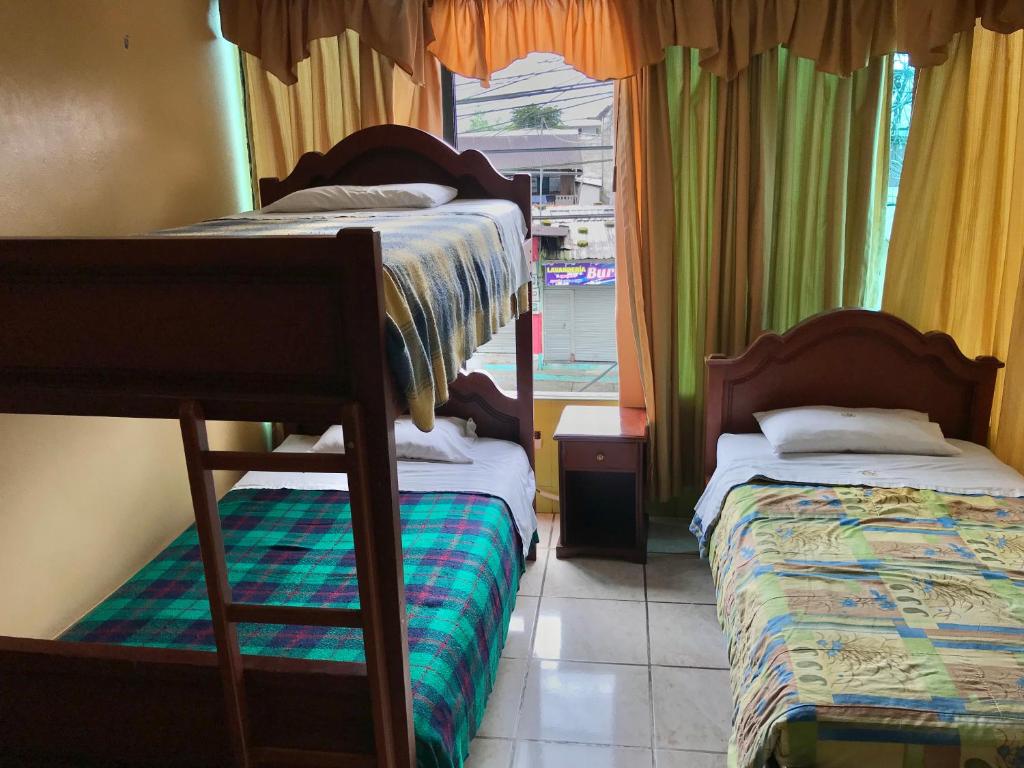 Postel nebo postele na pokoji v ubytování Kanoas Hostal