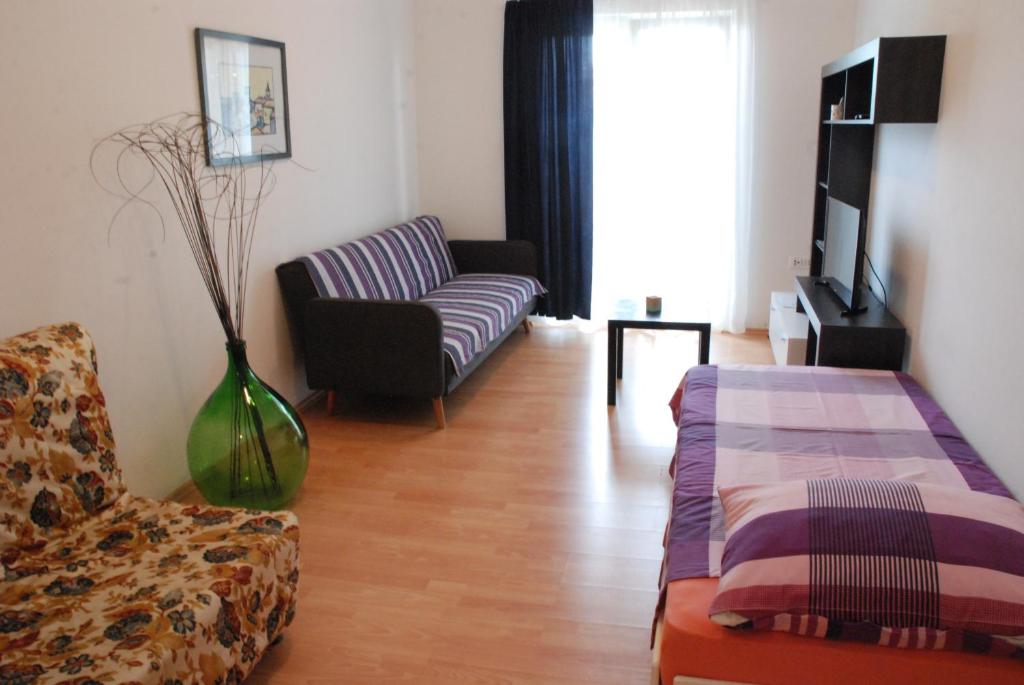 Postel nebo postele na pokoji v ubytování Apartmani Radin