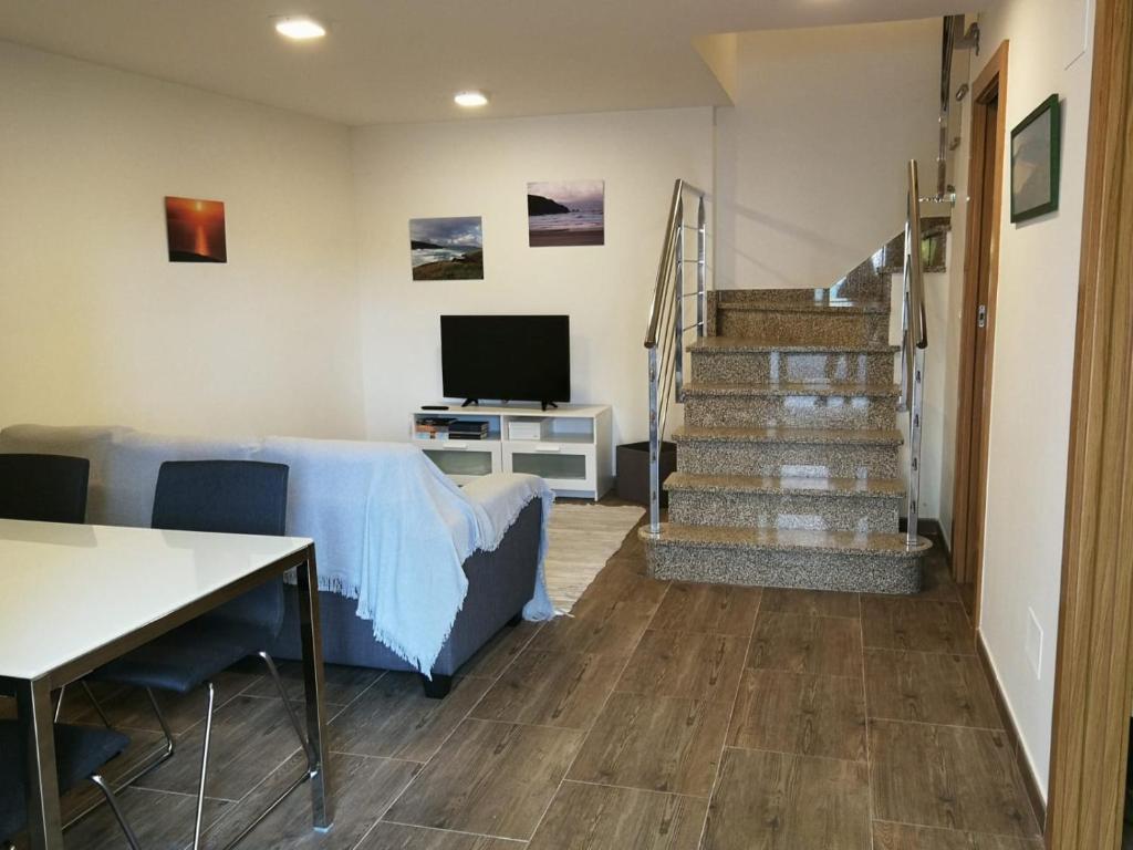 TV a/nebo společenská místnost v ubytování Casa rural Camelle Casa dos avós