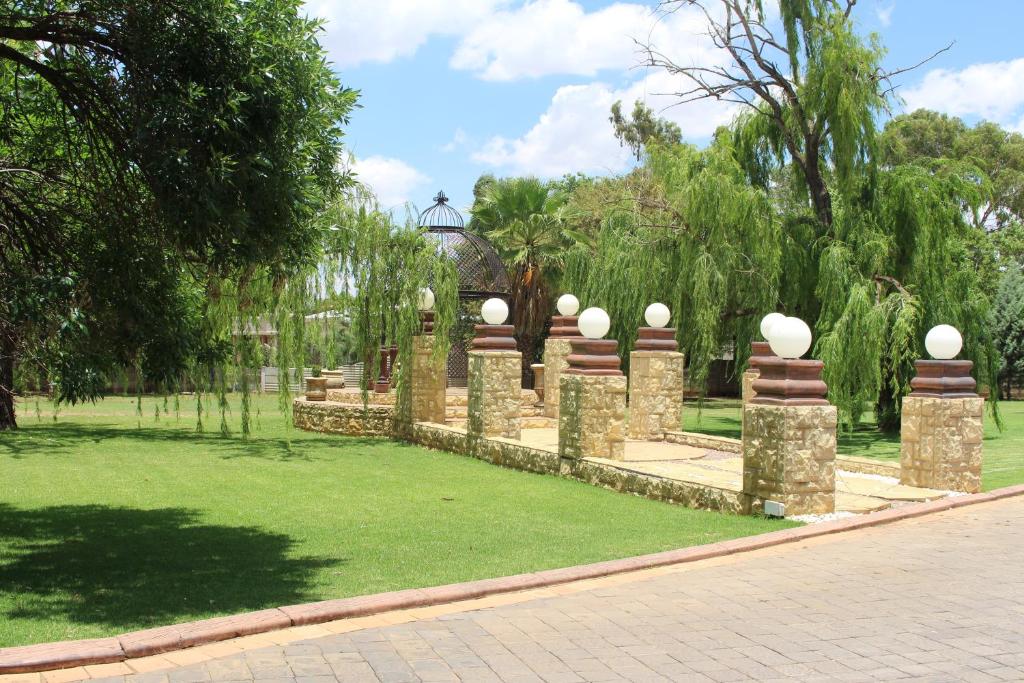 a park with a bunch of stone monuments at The Willow Tree Guesthouse in Klerksdorp