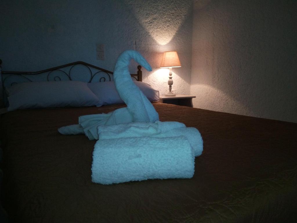 Łóżko lub łóżka w pokoju w obiekcie Εmmi