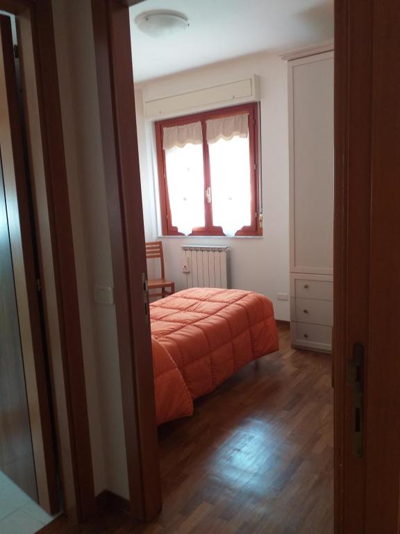 A bed or beds in a room at Casa Vacanze "Ai piedi di Assisi"