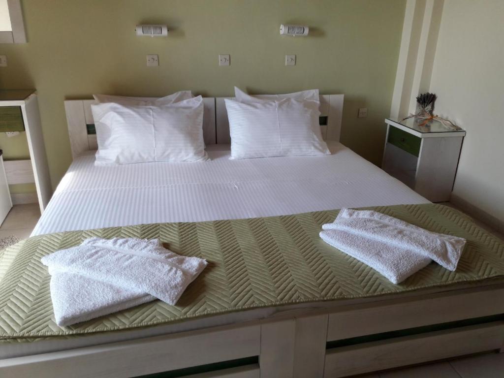 Postel nebo postele na pokoji v ubytování Epi Apartments