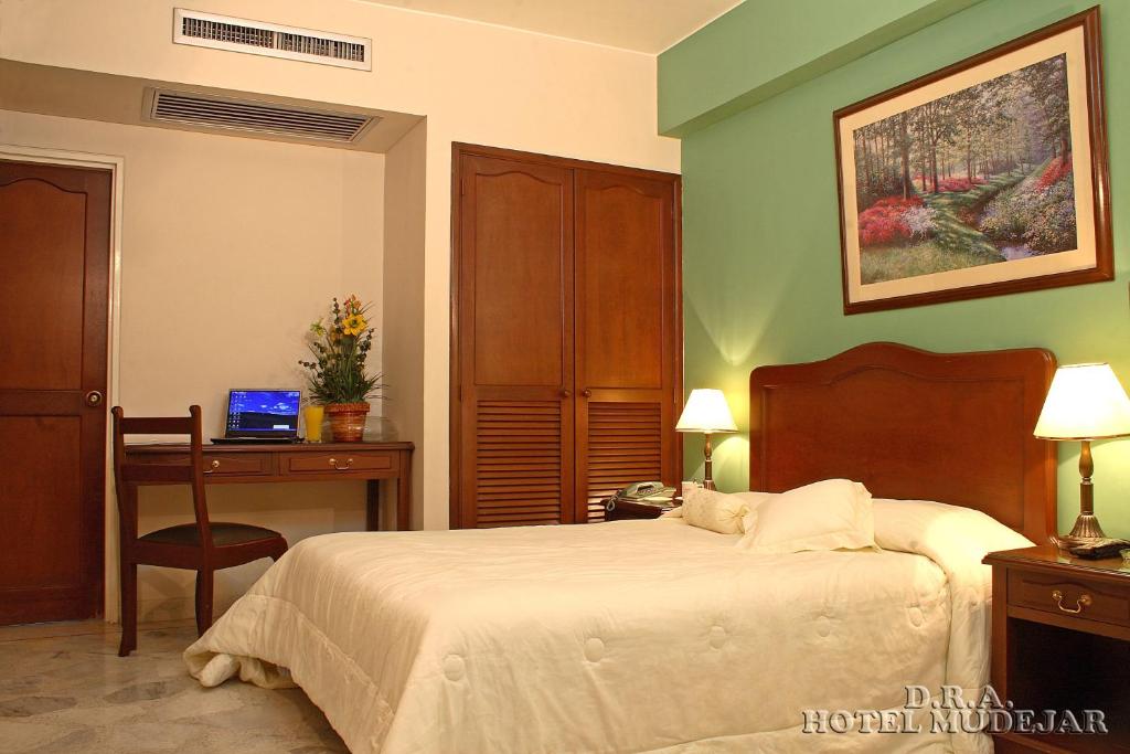 Säng eller sängar i ett rum på Hotel Mudejar