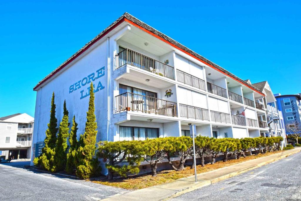 a white building with a sign on the side of it at Shore Lea 102 in Ocean City